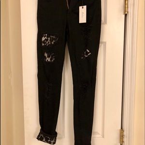 Peekaboo cheetah print black jeans